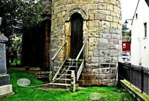 Spiral of energy from a grave attracted into the resonant cavity of the Abernethy Round Tower